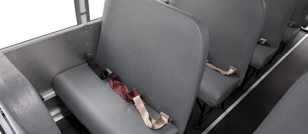 Closeup of gray seats with safety belts